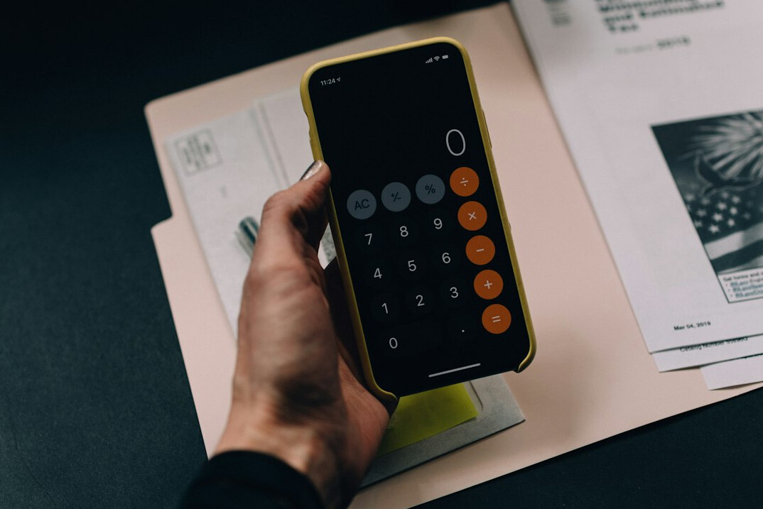 person tracking expenses at home