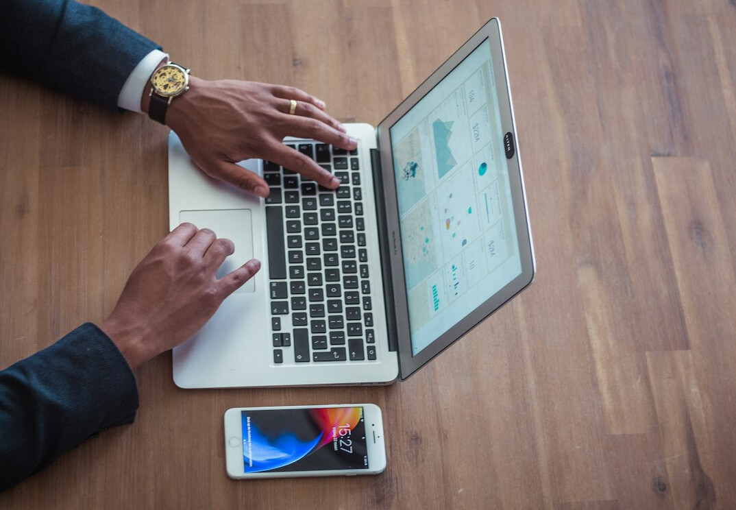 person planning budget on laptop