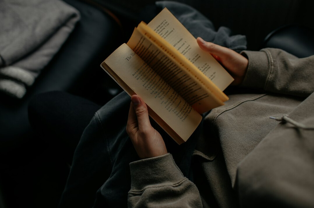 person reading financial book